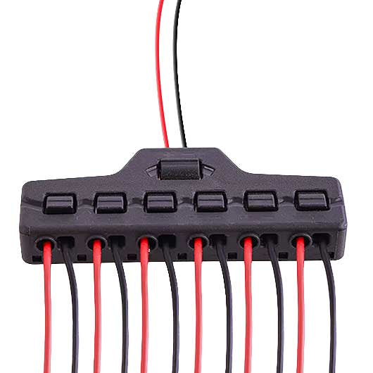 Black electrical connector with red and black wires on a white background